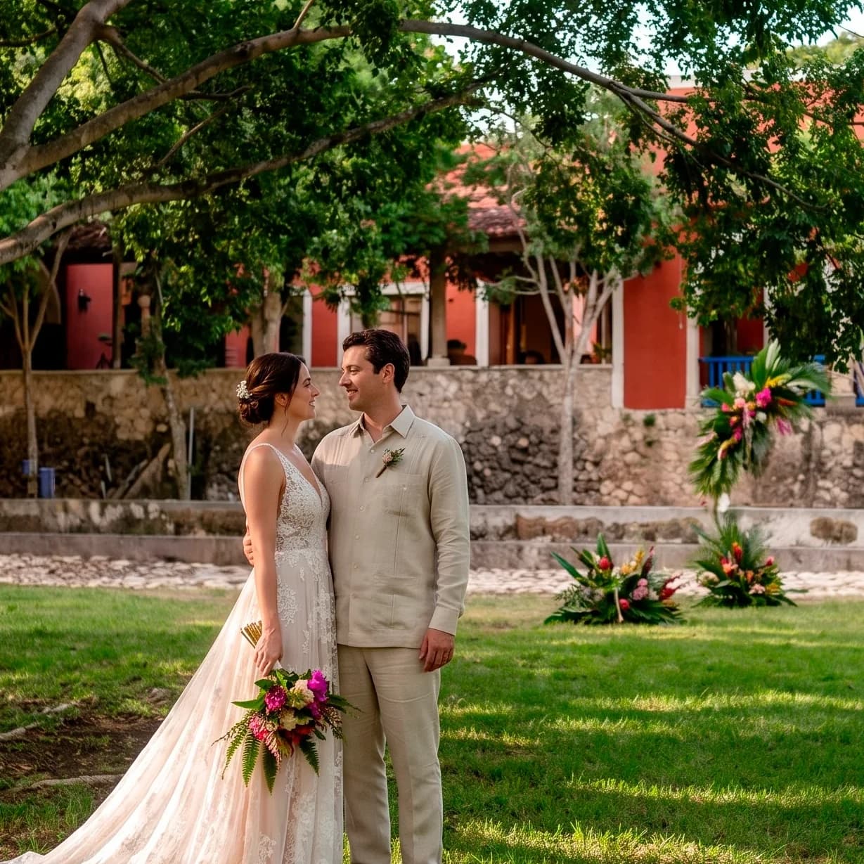 Bride and groom in front of the Hacienda Zamná facade