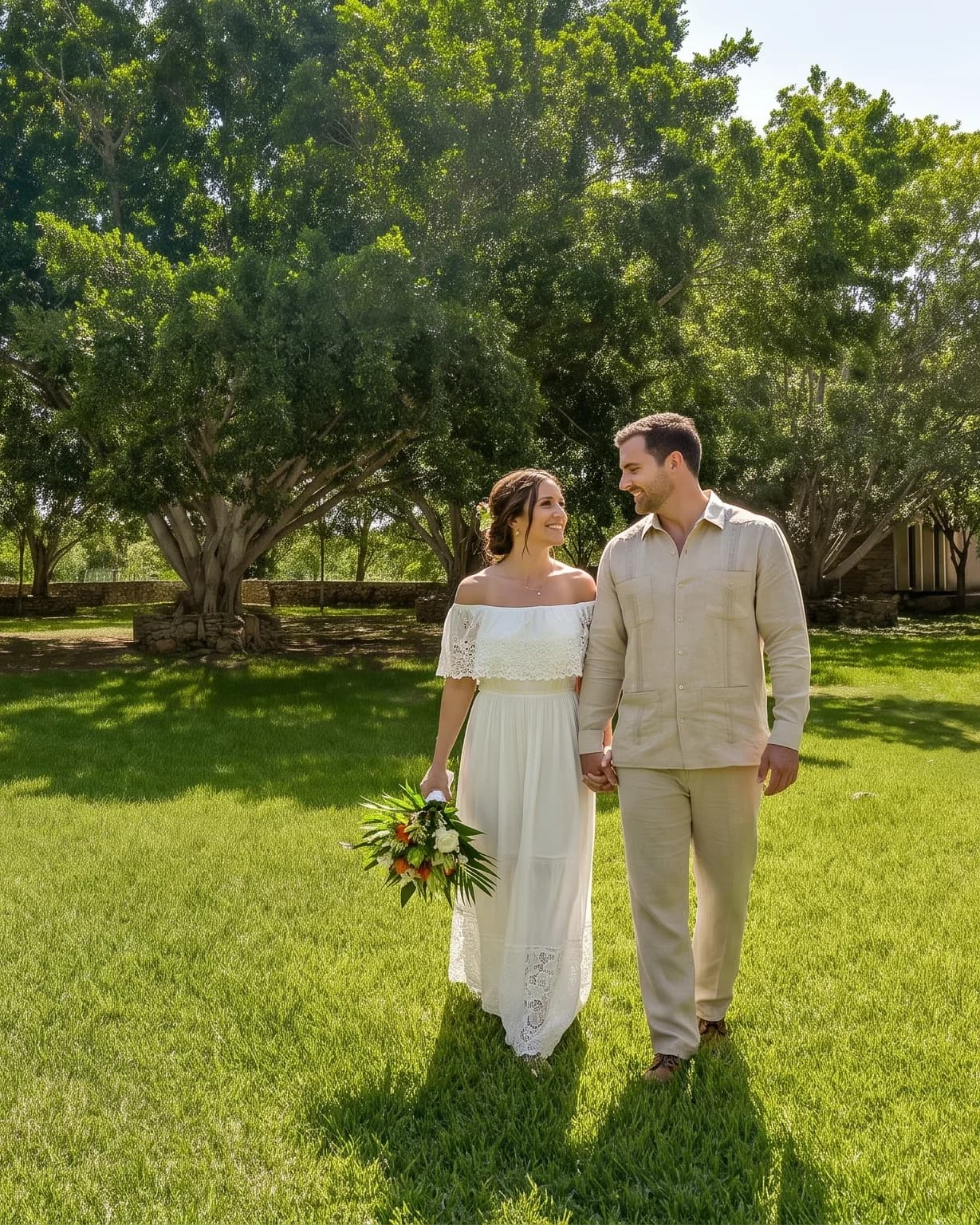 Bride and groom walking through the gardens at Hacienda Zamná
